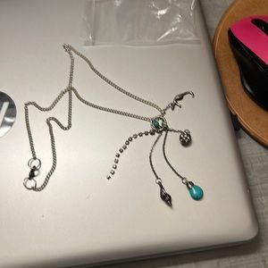 Turquoise and silver chain with dangals hanging